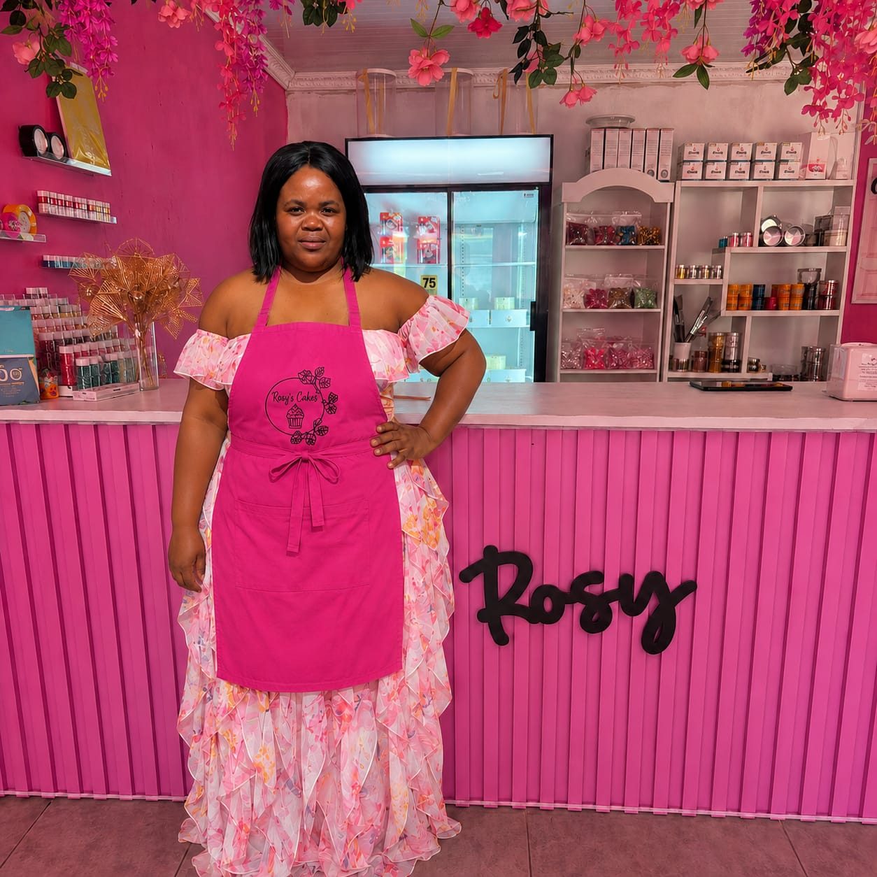 Palesa Mkhwanazi, founder of Rosy's Cakes and Events, standing in her Protea Glen shop